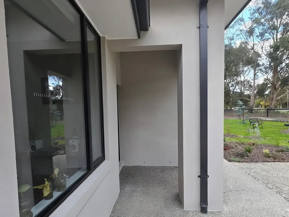 Smooth render on the walls and porch pier of a single-storey home in Riddells Creek